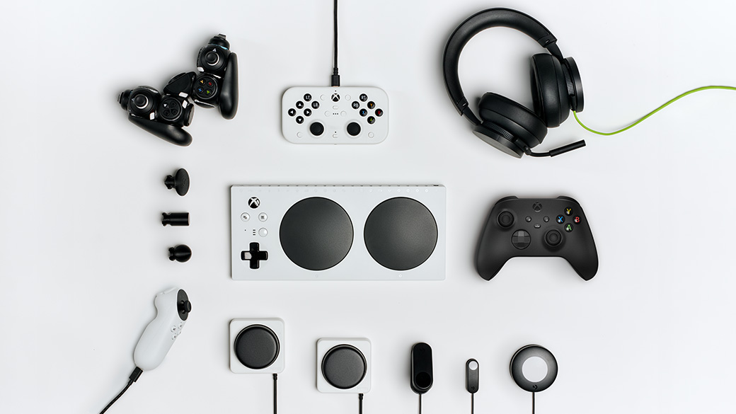 A variety of controllers and devices including the Xbox Adaptive Controller, the Xbox Adaptive Joystick, headphones, and various switches and buttons